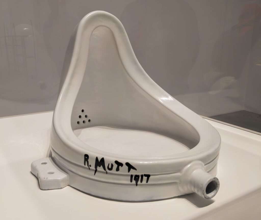 A photo of the reproduction of Fountain by Marcel Duchamp that is displayed in the Tate Modern, London.